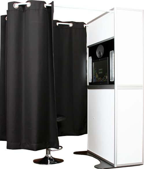 A black and white photo booth with a black curtain, perfect for events in Chicago, IL.