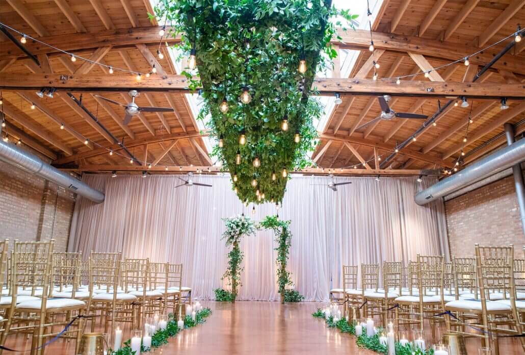 wedding ceremony Loft on Lake with greenery and candles