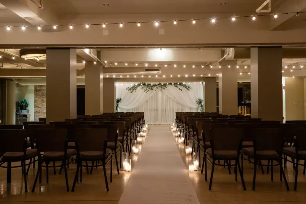night time wedding ceremony with candles at Pinstripes Chicago
